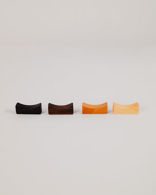 Four chopstick rest sets in cherry, maple, walnut, and Indian laurel
