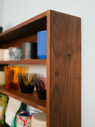 Monolith Wall Shelf styled in a kitchen with stoneware and ceramics