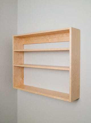 Monolith Wall Shelf in maple, alternate angle showing grain and rounded edges
